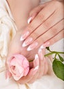 Hands with long artificial french manicured nails Royalty Free Stock Photo