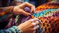 Hands loom knitting a colorful infinity scarf