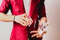 Hands of magician doing tricks with a deck of cards