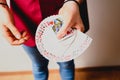 Hands of magician doing tricks with a deck of cards