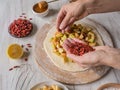 Hands make dough Apple pie or Goji berry