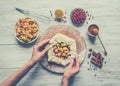 Hands make dough Apple pie or Goji berry