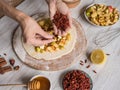 Hands make dough Apple pie or Goji berry