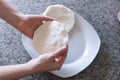 Hands making arepas in the kitchen. Latin food. Royalty Free Stock Photo