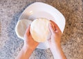 Hands making arepas in the kitchen. Latin food Royalty Free Stock Photo
