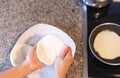 Hands making arepas in the kitchen. Latin food Royalty Free Stock Photo