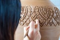 Hands of making clay pot on the pottery wheel ,select focus, close-up.