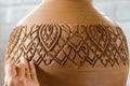 Hands of making clay pot on the pottery wheel ,select focus, close-up. Royalty Free Stock Photo