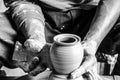 Hands of making clay pot on the pottery wheel ,select focus, close-up. Royalty Free Stock Photo