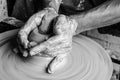 Hands of making clay pot on the pottery wheel ,select focus, close-up. Royalty Free Stock Photo