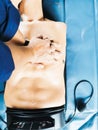Hands making a CPR pumping the chest on dummy patient, first aid training Royalty Free Stock Photo
