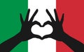 Hands making a heart shape on italian flag