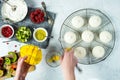 Hands Making Mini Tropical Fruit Pavlovas