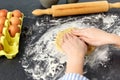 Hands making shortcrust pastry dough on table