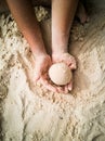 Hands making sphere sand ball by a child at the beach. Play sand Royalty Free Stock Photo