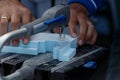 Hands of a male carpenter making a workpiece on a joiner`s machine Royalty Free Stock Photo