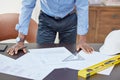 Hands, man and drawing on blueprint in table with pencil for planning a building design, layout and project as architect Royalty Free Stock Photo