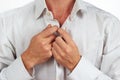 Hands man fastened his bright shirt closeup Royalty Free Stock Photo