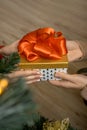 Man& x27;s hands giving a Christmas gift to woman. Royalty Free Stock Photo