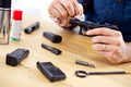 Hands, man with gun cleaning process at table for safety, self defense and handgun assembly. Caution, equipment and Royalty Free Stock Photo