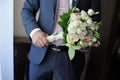 Hands of a man holding a beautiful bouquet of flowers Royalty Free Stock Photo