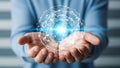 Man holding glowing digital sphere in hands Royalty Free Stock Photo