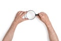 Hands of man holding the magnifying glass isolated on white background Royalty Free Stock Photo