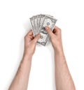 Hands of man holding one-dollar bills on white background. Royalty Free Stock Photo