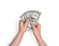 Hands of man holding one-dollar bills on white background. Royalty Free Stock Photo