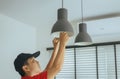 Hands man mechanic changing with new LED lamp light bulb,Power saving concept Royalty Free Stock Photo