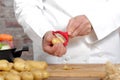 Hands of a man peeling potato with peeler Royalty Free Stock Photo