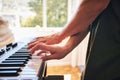 Hands, man and piano keyboard for talent, skills and creativity of band in home studio. Closeup, musician and fingers