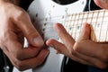 Hands of man playing electric guitar closeup Royalty Free Stock Photo