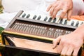 Hands of man playing mantra on accordion Royalty Free Stock Photo