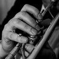 Hands of the man playing the trumpet closeup Royalty Free Stock Photo