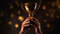 Hands of a man raising golden trophy after winning competition with glowing bokeh on black background, succees concept. Generative Royalty Free Stock Photo