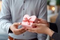 Hands man receiving gift box from hands loving woman, surprise on Valentines Day Royalty Free Stock Photo