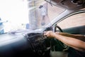 Hands of man removing old car window film Royalty Free Stock Photo