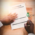 Hands of a man signing insurance document Royalty Free Stock Photo