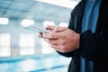 Hands, man and smartphone for texting by swimming pool for communication, social media or contact on web. Aquatic sports Royalty Free Stock Photo