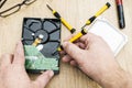 Hands of a man taking apart a broken hard disk. Technology and services Royalty Free Stock Photo