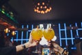 Hands of man and woman cheering with glasses of pink champagne. Royalty Free Stock Photo