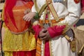 Hands of an man and a woman decorated for an indian wedding. Woman and man wearing traditional Rajasthani dress participate in Royalty Free Stock Photo