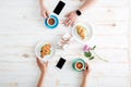 Hands of man and woman drinking coffee with croissants Royalty Free Stock Photo