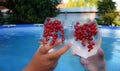 the hands of a man and a woman are holding glasses with a non-alcoholic refreshing summer cocktail on the background of Royalty Free Stock Photo