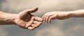 Hands of man and woman reaching to each other, support. Hands of man and woman on blue sky background. Giving a helping Royalty Free Stock Photo