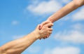 Hands of man and woman reaching to each other, support. Giving a helping hand. Lending a helping hand. Solidarity Royalty Free Stock Photo