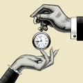 Hands of man and woman with a retro pocket watch