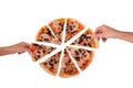 Hands of a man and a woman take slices of pizza with ham, mozzarella, mushrooms and olives, top view, isolated on white