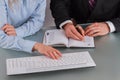 Hands of man and woman working together in office. Royalty Free Stock Photo